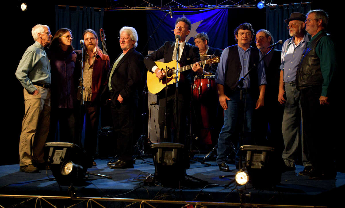 Lyle Lovett (center) performs the song "Closing Time" with some original musicians from Anderson Fair during a live broadcast at the HoustonPBS LeRoy and Lucile Melcher Center for Public Broadcasting Wednesday, Sept. 21, 2011, in Houston. (Cody Duty / Houston Chronicle )