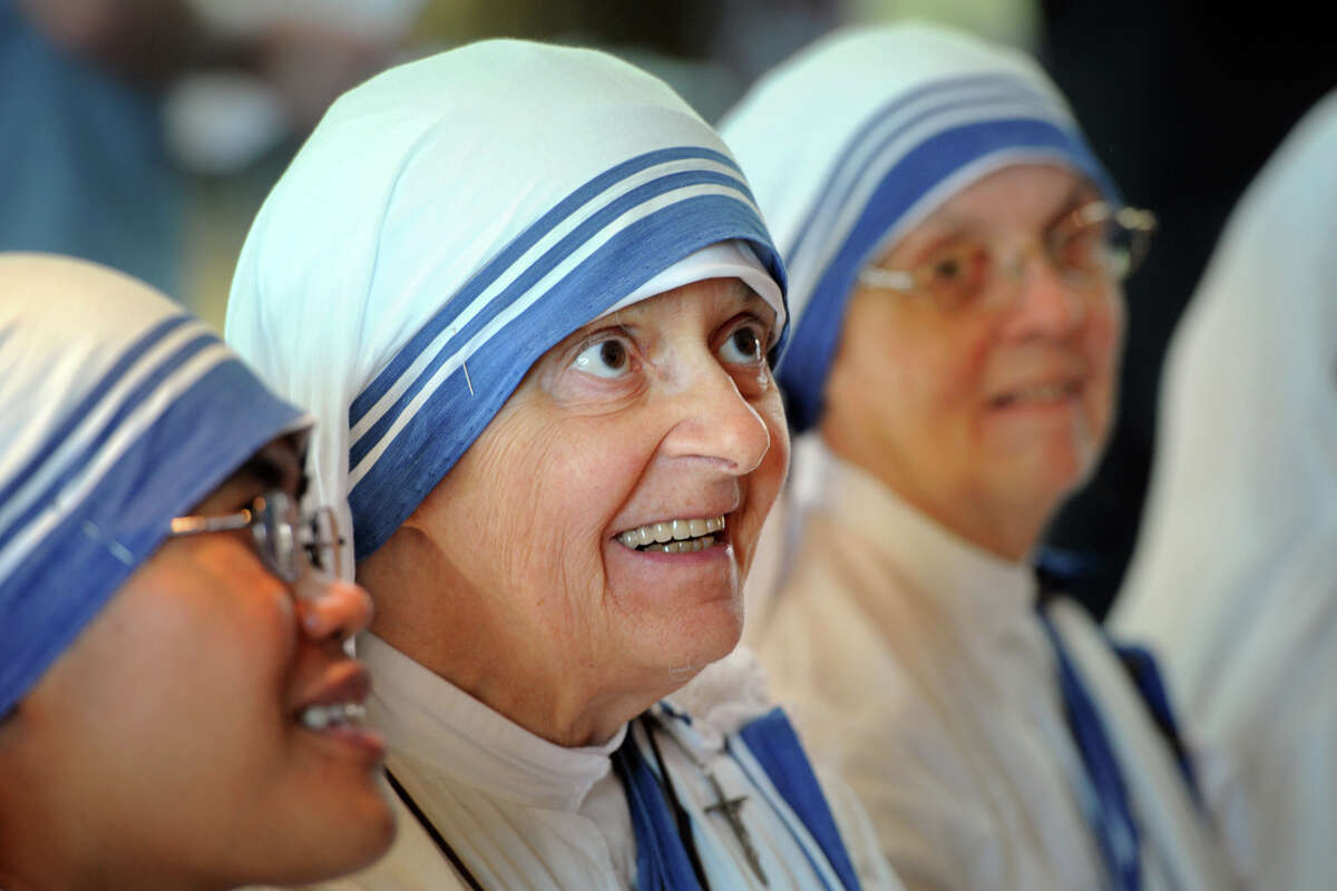 Sister Mary Bernard, a Missionary of Charity from Bridgeport, smiles at the unveiling ceremony of a painting of Mother Teresa held at the Knights of Columbus Museum, in New Haven, Conn. Sept. 2, 1016. Mother Teresa will be canonized Sunday.