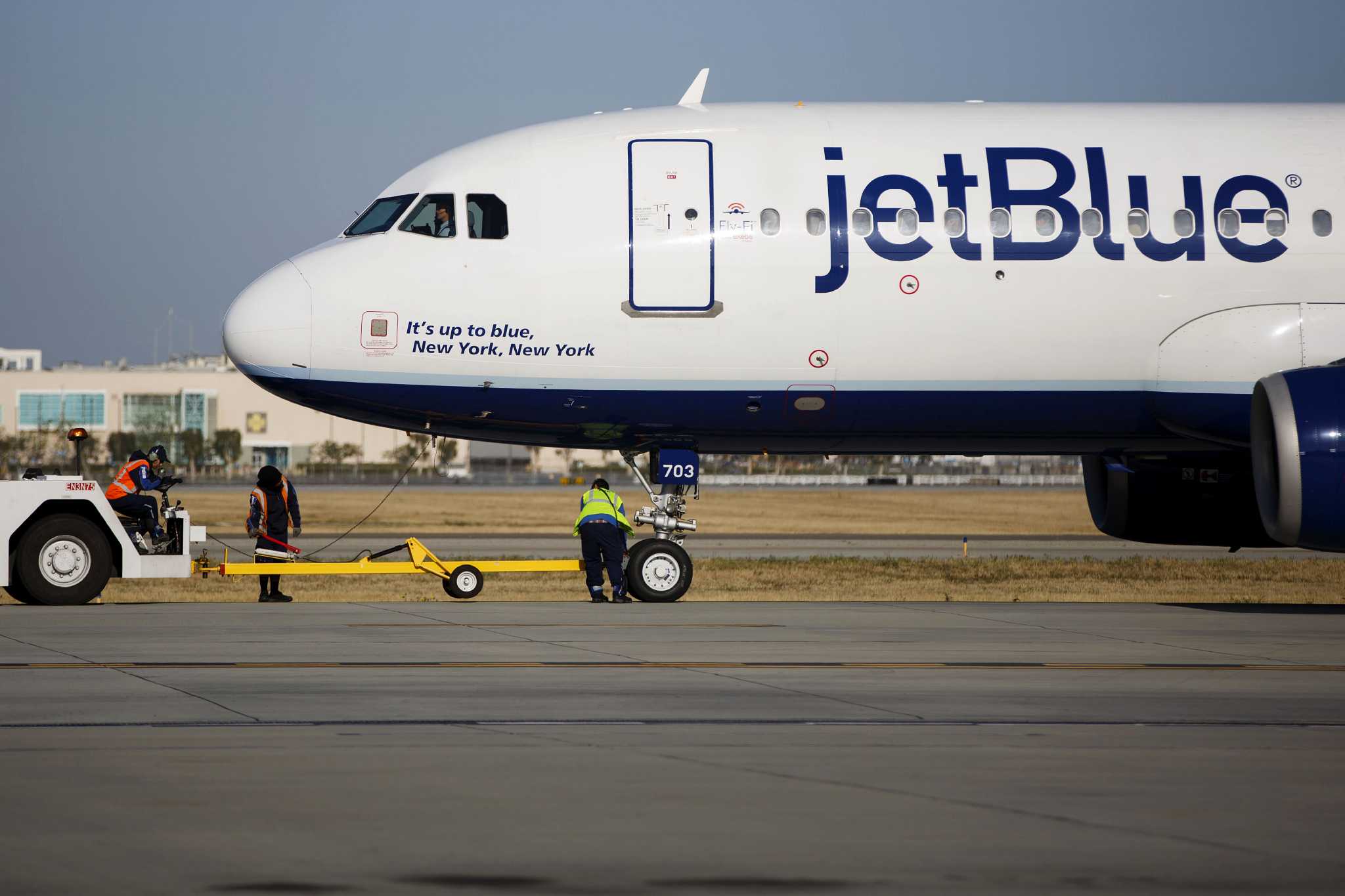JetBlue is requiring passengers to wear masks. American Airlines is