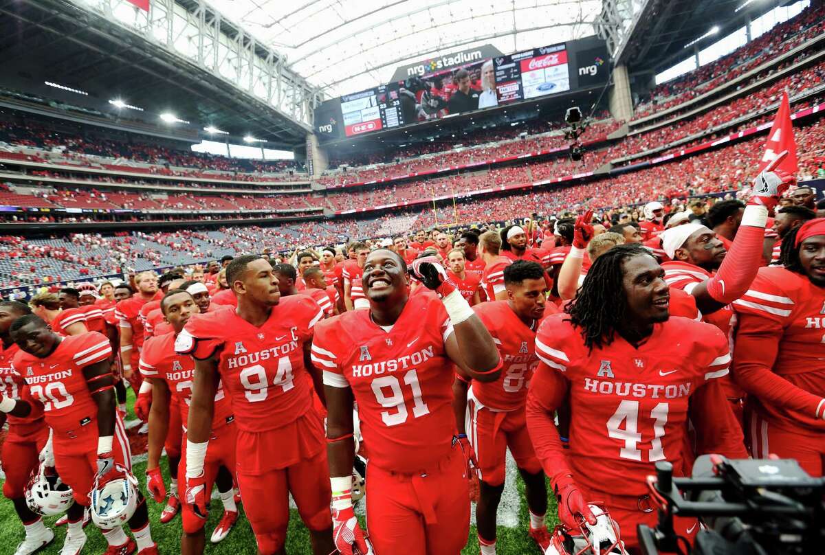 University of Houston football players celebrate with their fans after defeating University of Oklahoma at the Advocare Texas Kickoff Game at NRG Stadium Saturday, Sept. 3, 2016, in Houston . The Cougars won the game 33-23.