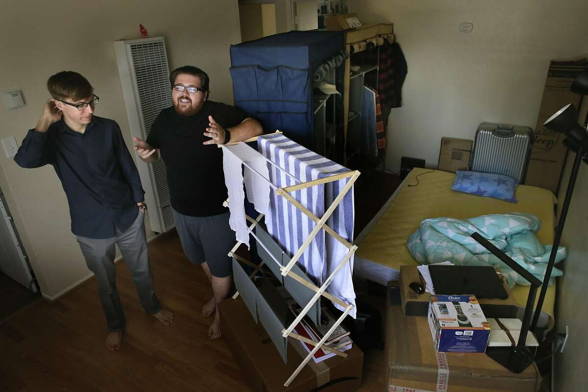 UC Berkeley students Tyler Long, (left) and Mikole De Laurentiis at their two bedroom apartment in Berkeley, Calif. on Sat. Sept. 3, 2016. With the steep prices for apartment rentals they added a third bedroom space in the living room that is currently rented out to cut down on their monthly rental costs.