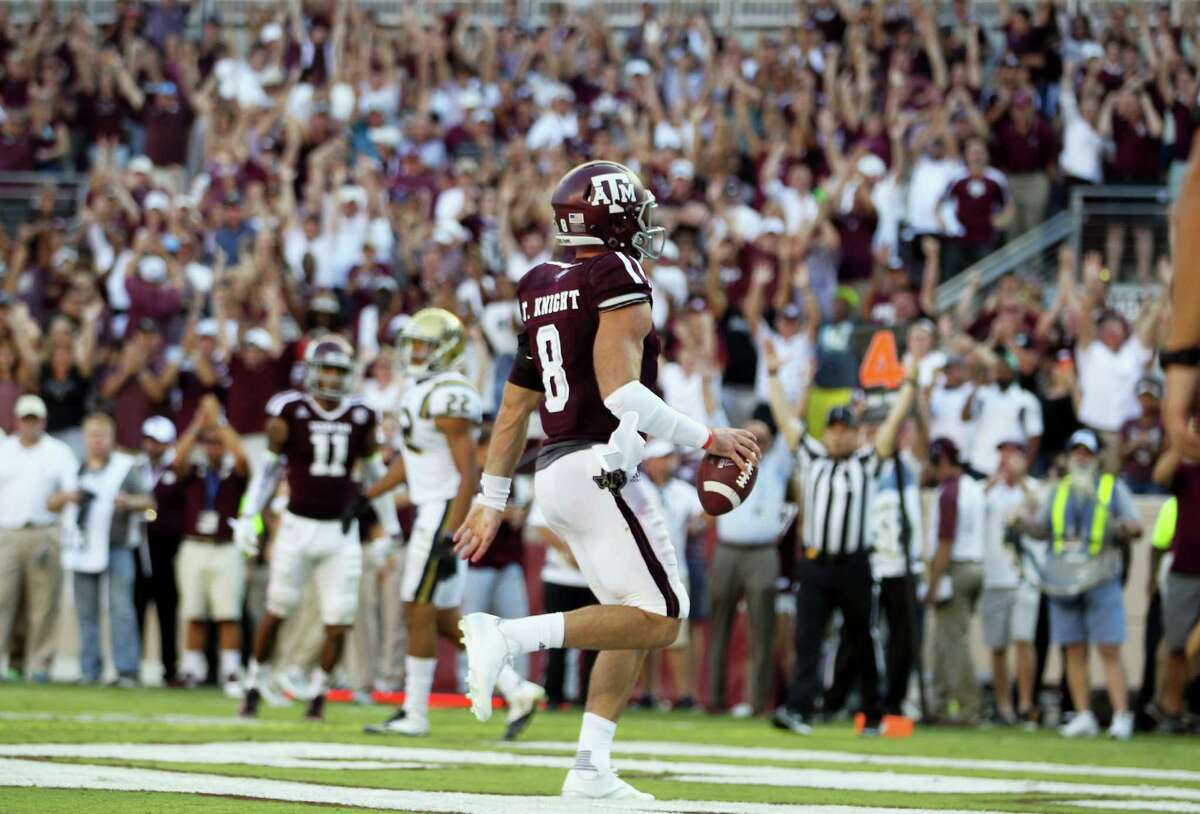 Texas A&M quarterback Trevor Knight (8) jogs into the end zone for the go ahead touchdown against UCLA in overtime of an NCAA college football game Saturday, Sept. 3, 2016, in College Station, Texas. Texas A&M won 31-24 in overtime. (AP Photo/Sam Craft)