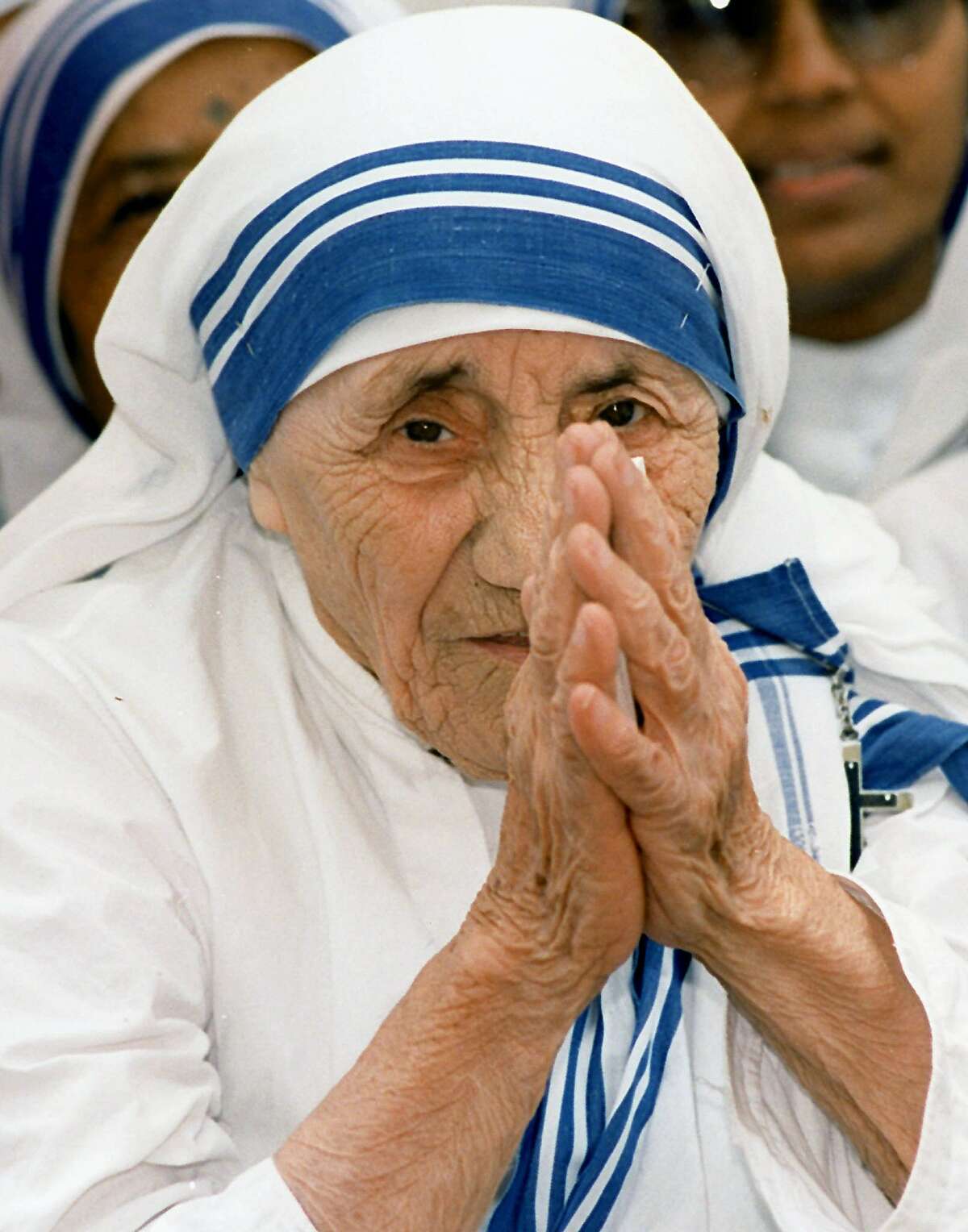 In this file photograph taken on May 15, 1997, Mother Teresa greets people at the Missionaries of Charity For Destitute Children in New Delhi. ( AFP / Getty Images)