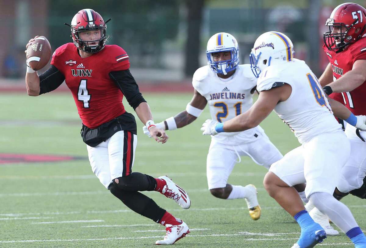 UIW quarterback Trent Brittain rolls to the outside against Texas A&M-Kingsville at Benson Stadium on Sept. 3, 2016.