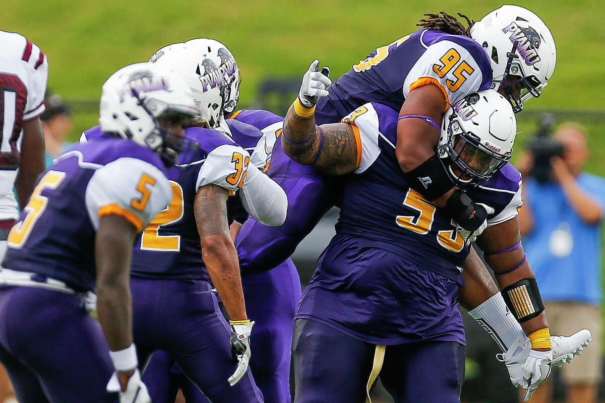 Prairie View Am Panthers defensive tackle DeVohn Reed (95) jumps on the back of linebacker Don Rittenhouse (55) to celebrate after Rittenhouse made a tackle as the Prairie View Am Panthers take on the Texas Southern Tigers at Panther Stadium at Blackshear Field Sunday, September 4, 2016 in Prairie View.