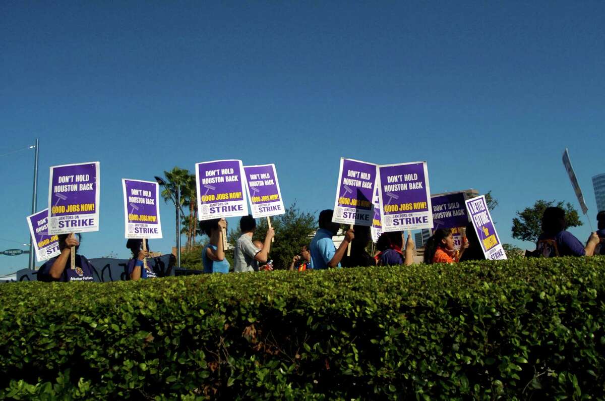 Hundreds of Houston area janitors and supporters marched down Post Oak Rd. during a Service Employees International Union (SEIU) march and rally that began at Grady Park in the Galleria, Saturday, Oct. 28, 2006. About 4,700 low-wage janitors in Houston have formed a union with SEIU and an additional 600 janitors will soon join in their fight for fair wages and benefits. (Johnny Hanson for the Houston Chronicle)