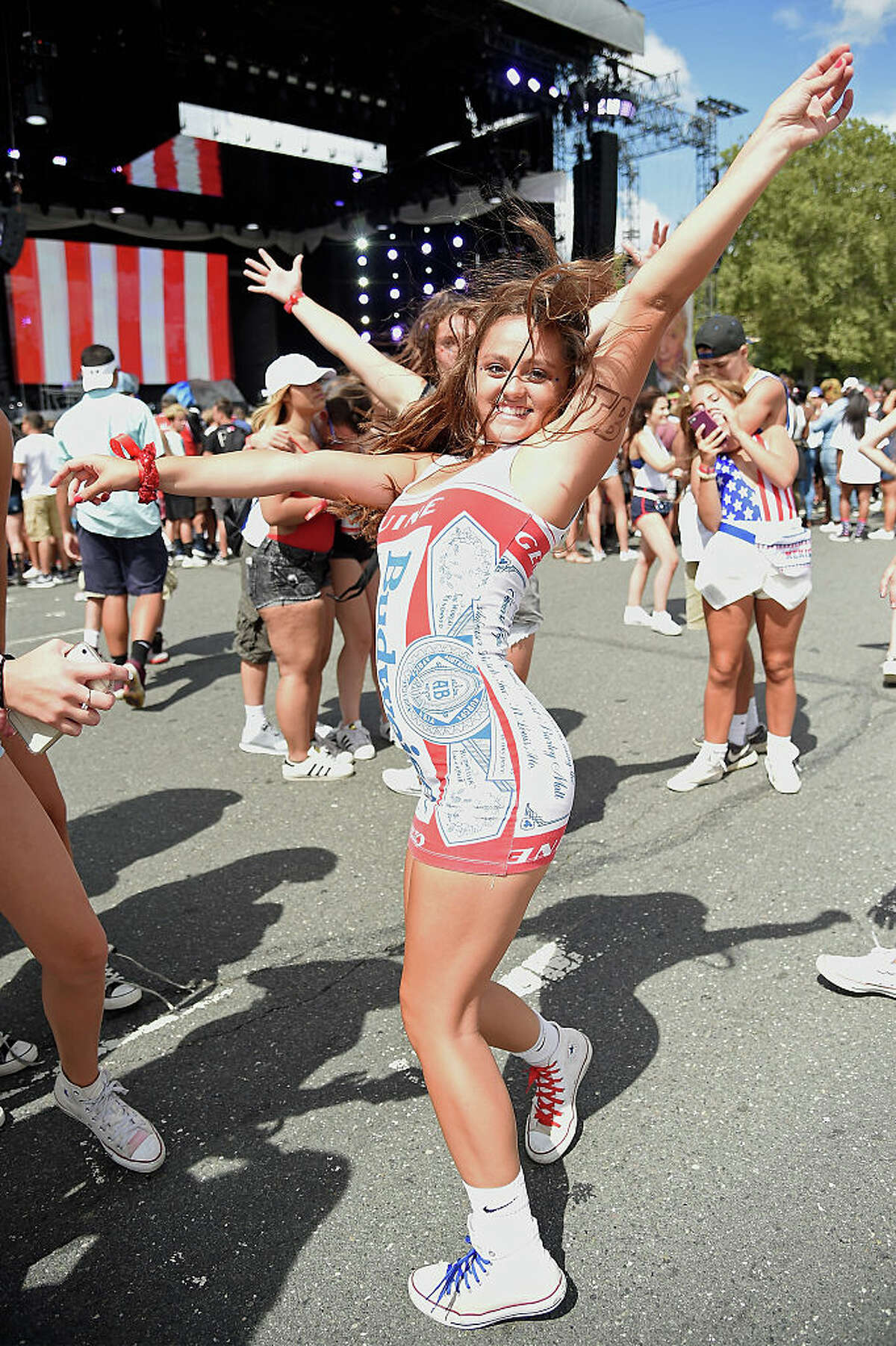 A fan in a Budweiser dress dances during the 2016 Budweiser Made in America Festival at Benjamin Franklin Parkway on September 3, 2016 in Philadelphia, Pennsylvania. (Photo by Kevin Mazur/Getty Images for Anheuser-Busch)