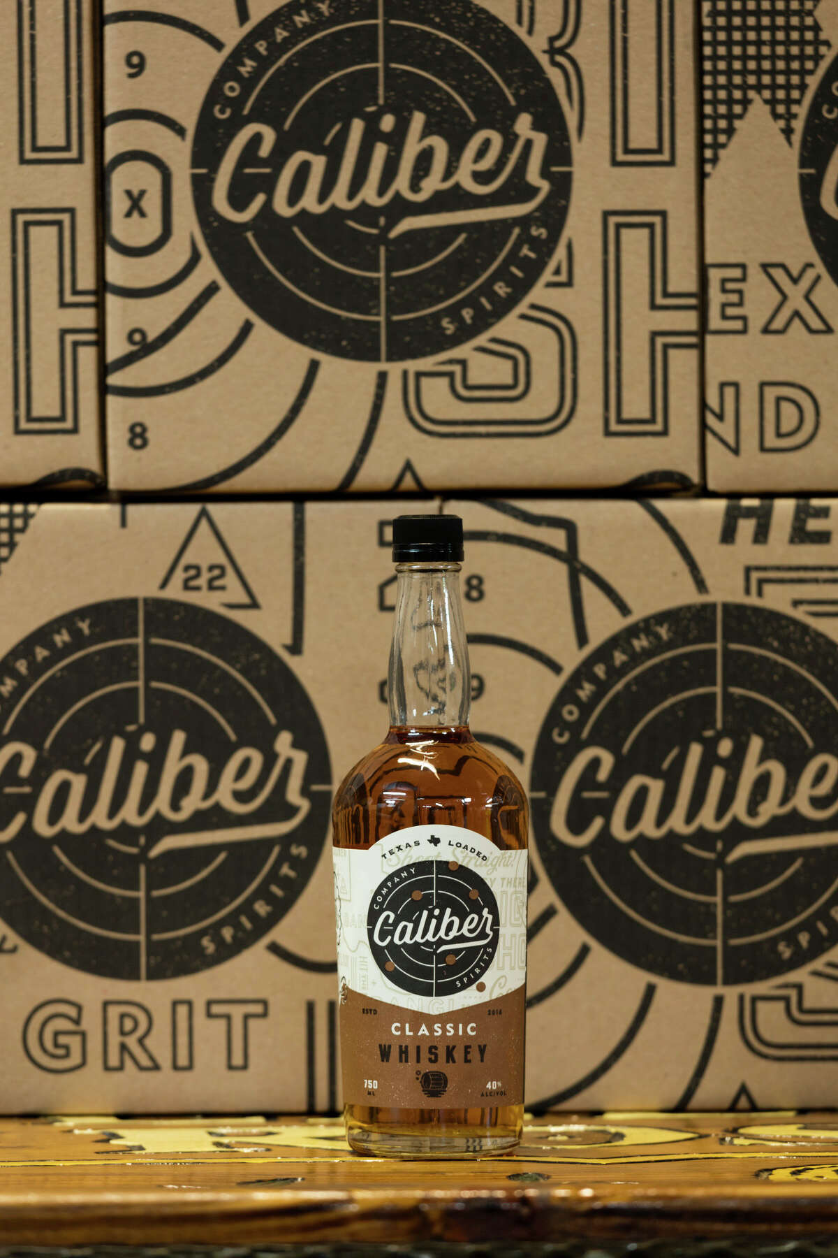 Caliber Company Spirits, a new brand from Yellow Rose Distilling, has created a new line of flavored whiskeys. Shown: Classic whiskey with flavors of vanilla bean, honey and oak.