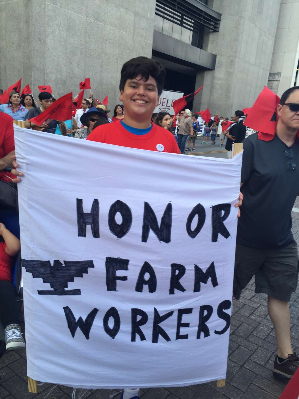 Ramon James Contreras, 13, joined hundreds of people in a march from the San Fernando Cathedral to Milam Park on Monday, Labor Day. The march commemorated the 50th anniversary of the 1966 Starr County strike and march, which started in Rio Grande City and ended in Austin on Labor Day.