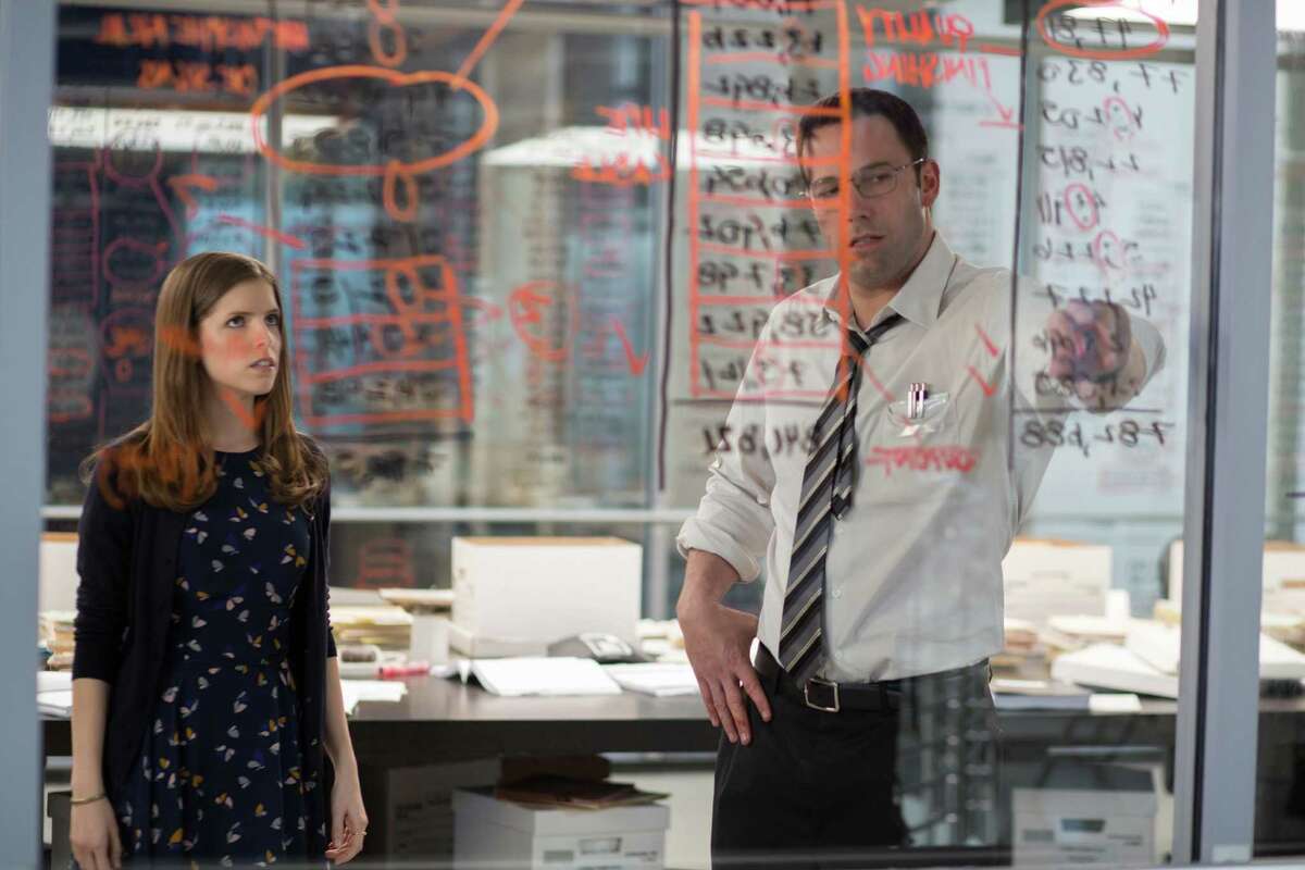 In this image released by Warner Bros. Pictures shows Anna Kendrick, left, and Ben Affleck in a scene from, "The Accountant," in theaters on October 14. (Chuck Zlotnick/Warner Bros. Pictures via AP)