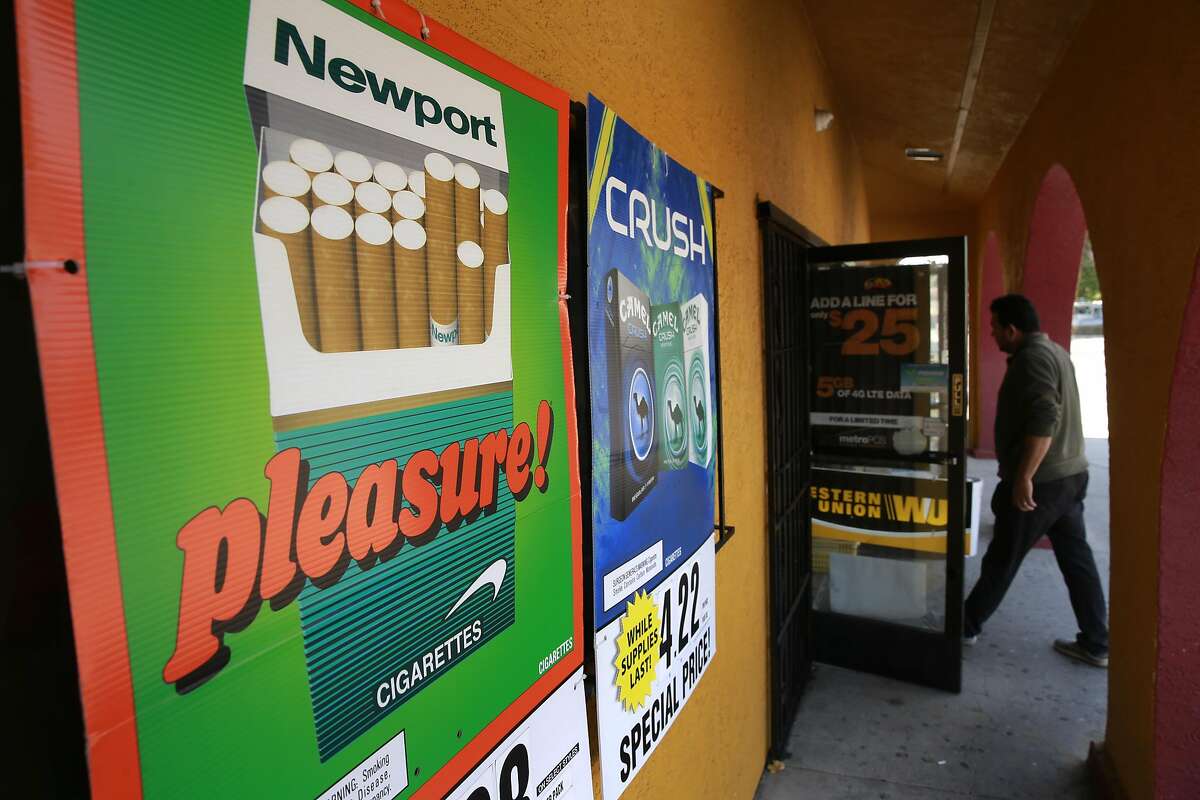 Cigarette ads outside the Mercado La Hacienda market in San Pablo, Calif. on Tues. Sept. 6, 2016. California's proposition 56, the cigarette initiative is passed would add $2 to a pack of cigarettes which would go to health-care programs, smoking prevention and research.