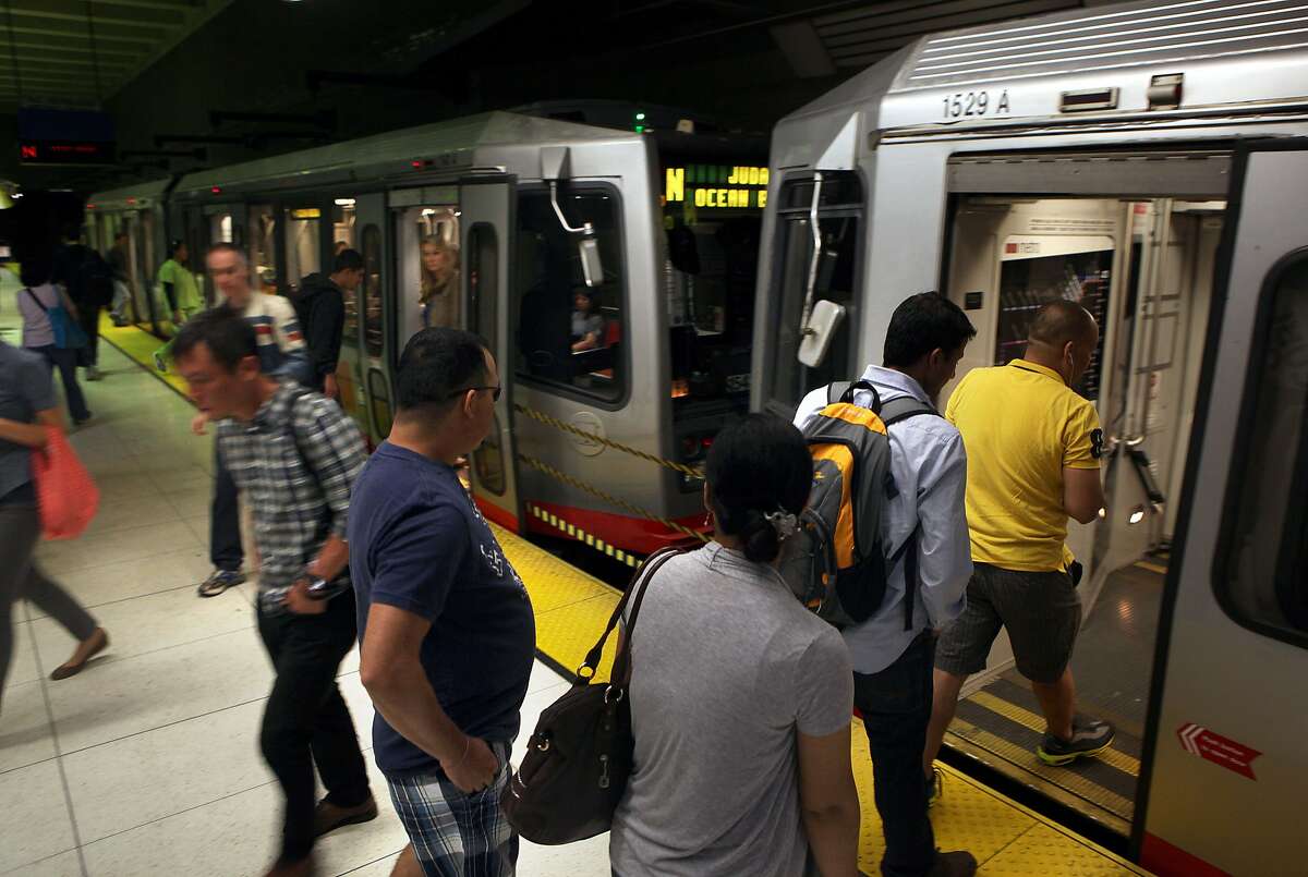 Commuters enter and exit line N Muni bus at the Van Ness subway station in San Francisco, Calif., on Thursday, October 2, 2014. Three transportation propositions are on the November ballot including Proposition B--an increase in the Muni budget to keep pace with the population growth.