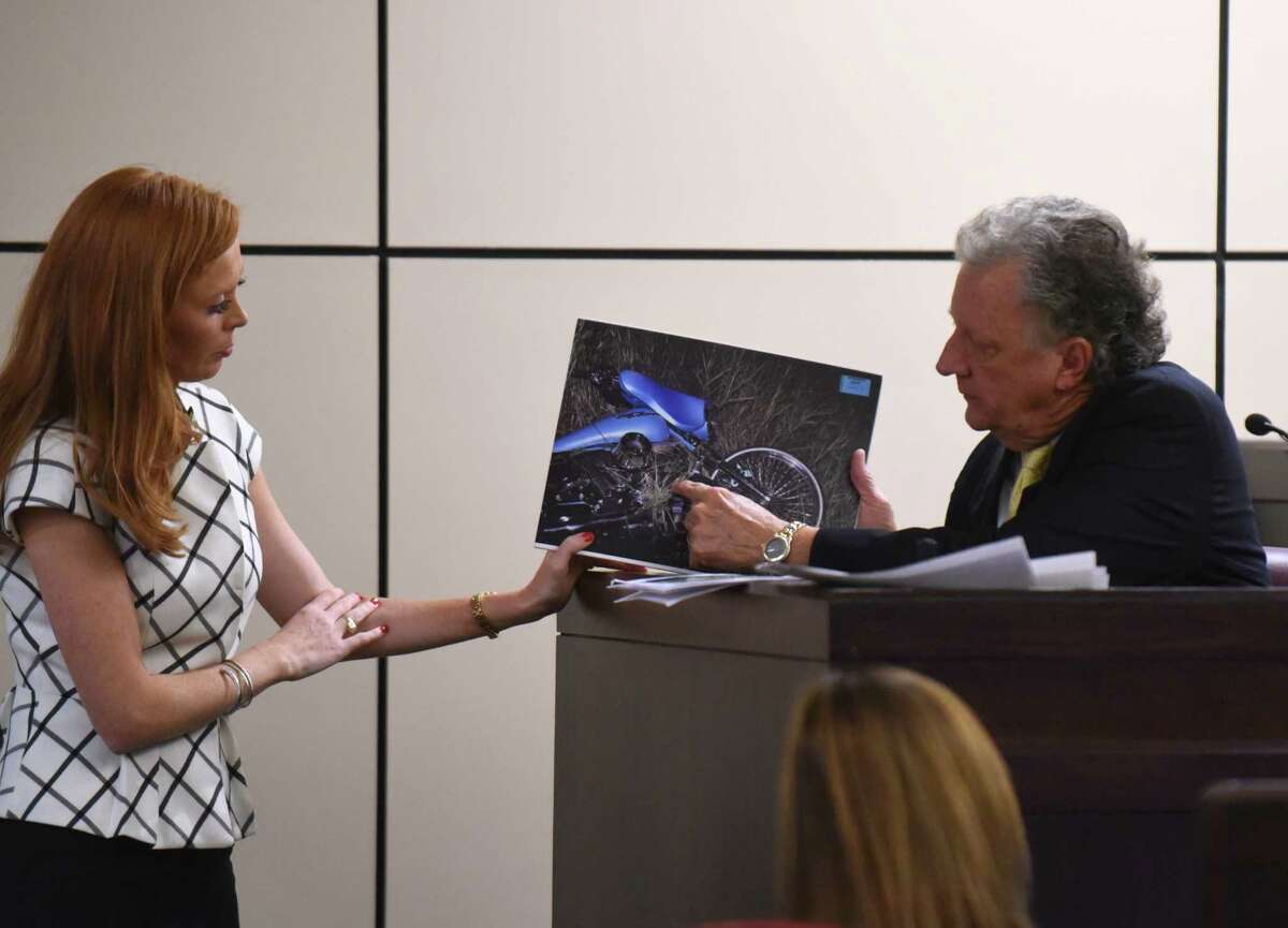 Defense attorney Leigh Cutter asks Charles Ruble, an accident analyst, about a photograph of Bill Hall Jr.’s wrecked motorcycle during the murder trial of his wife, Frances Hall.