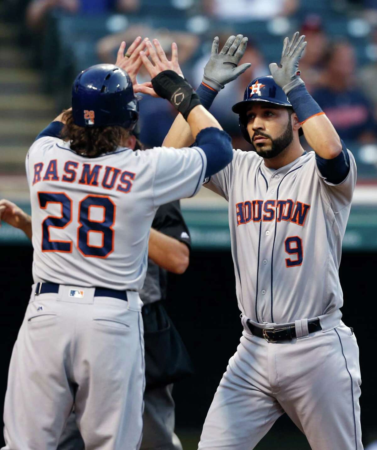 Marwin Gonzalez is greeted by Colby Rasmus after striking the big blow Tuesday night - a three-run homer in the second inning.