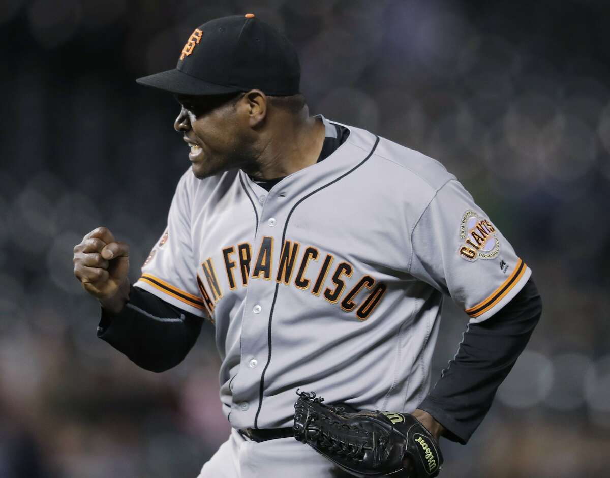 San Francisco Giants relief pitcher Santiago Casilla reacts after getting Colorado Rockies' Gerardo Parra to ground into a double play to end a baseball game Tuesday, Sept. 6, 2016, in Denver. The Giants won 3-2. (AP Photo/David Zalubowski)