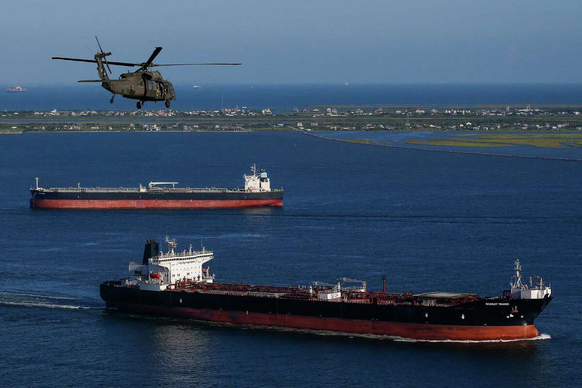 An Army Black Hawk helicopter, carrying U.S. Army Corps of Engineers officials, flies over the ship channel Wednesday, September 7, 2016. A dike, called the "Ike Dike," is being proposed to protect Galveston, Bolivar and the Galveston Bay area from storm surges.