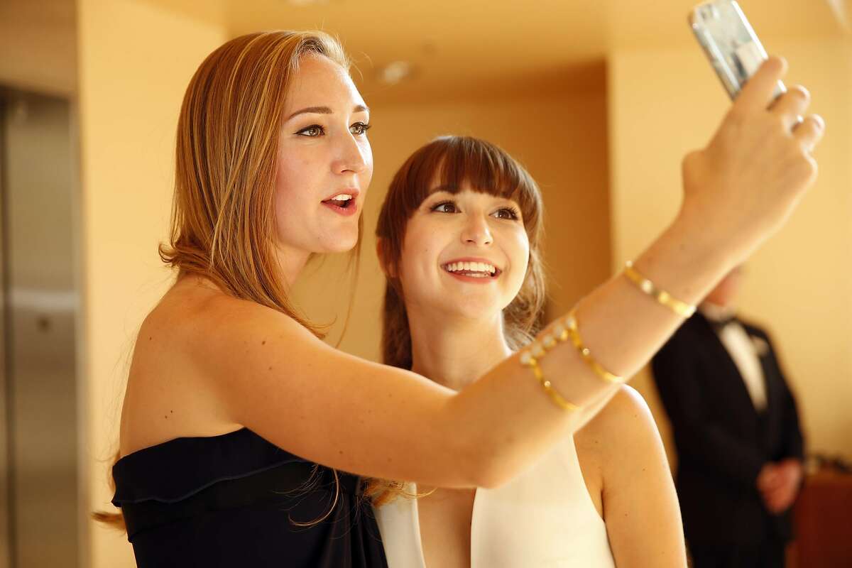 Caroline Joost and Rose Fisher take a selfie before San Francisco Symphony Opening Night Gala in San Francisco, Calif., on Wednesday, September 7, 2016.