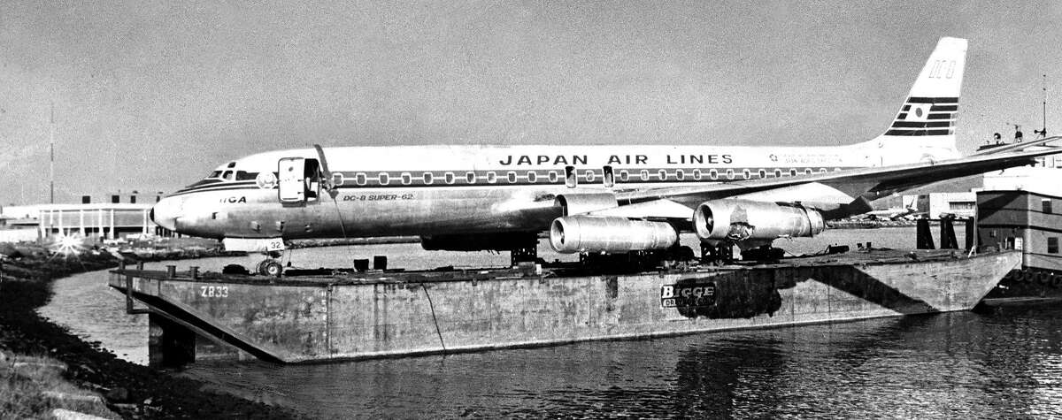 The Japan Air Lines flight that landed in the Bay on Nov. 22, 1968, is lifted into a barge later the same day.