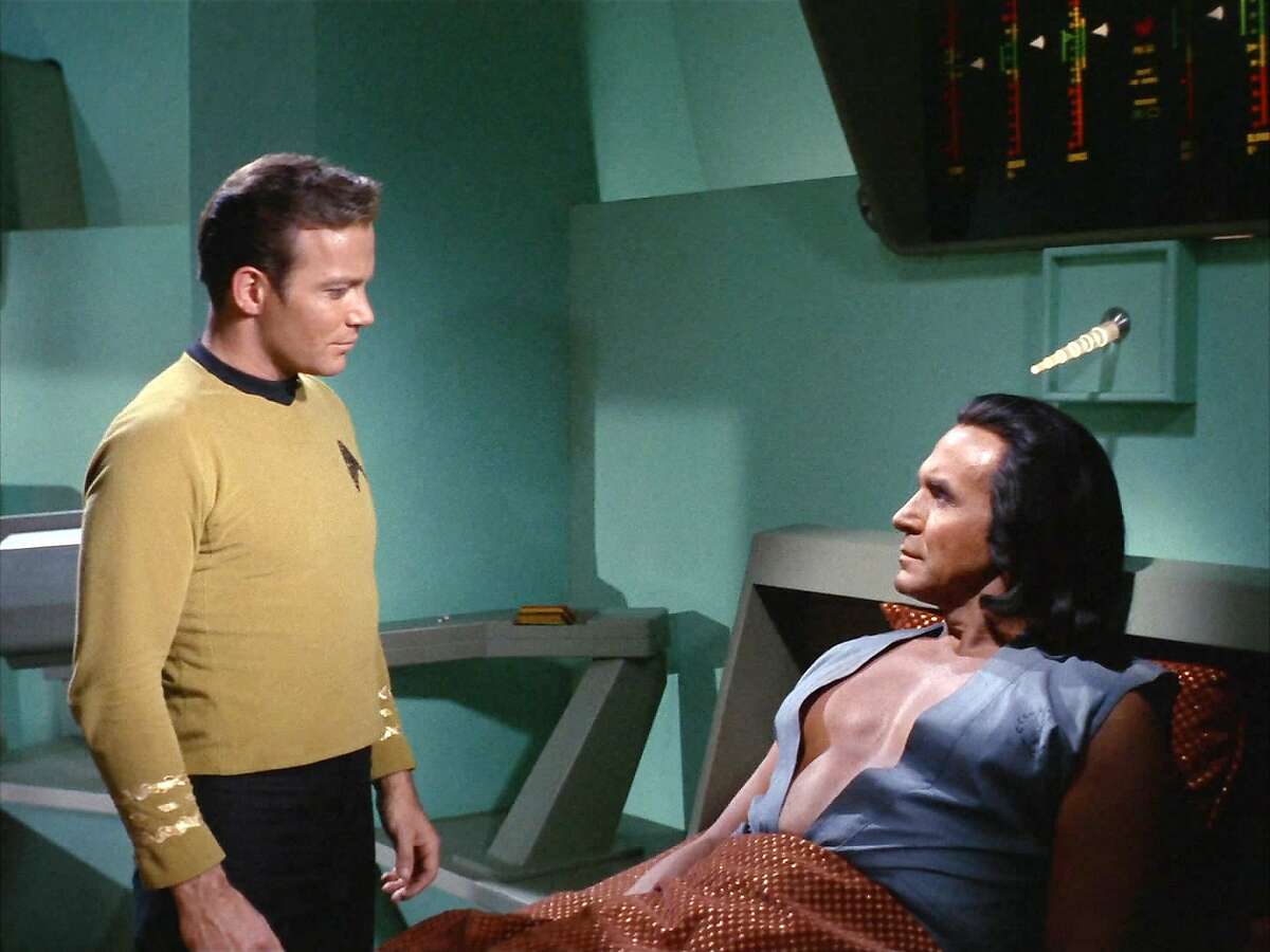 I see your toupee and raise you one shoulder-length wig: The studly Khan (Ricardo Montalban) flaunts his bioengineered pecs at Kirk, making the 5-foot-10 captain look like the 98-pound weakling on the beach. Both men wore hairpieces.