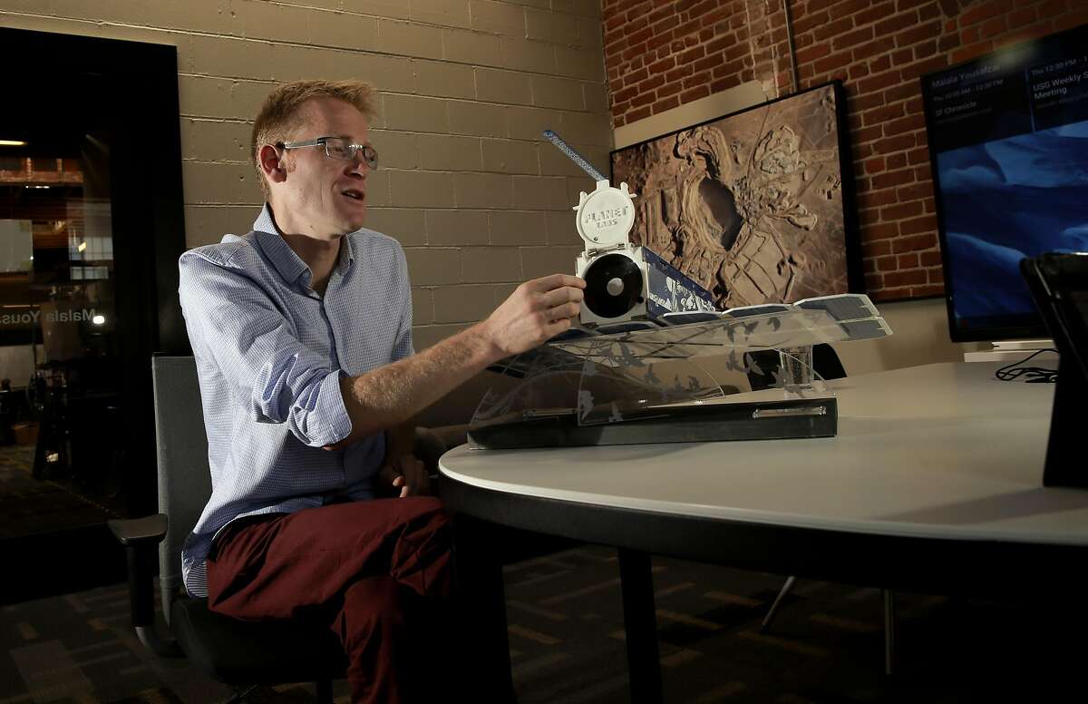 Will Marshall the Co-Founder and CEO of Planet Labs Inc. with a model of the Dove satellite at their headquarters in downtown San Francisco, Calif., seen on Thursday September 8, 2016, where they create the shoe box size satellites that they send into space that gather photographs of earth.