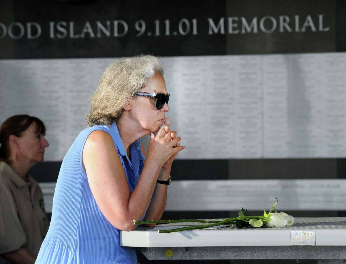 Cos Cob resident Diane Rasweiler in a moment of silence during the 15th annual 9/11 Memorial Ceremony, honoring and celebrating the lives of those killed in the September 11, 2001 terrorist attacks at the 9/11 Memorial in Sherwood Island State Park in Westport,Conn., Thursday, Sept. 8, 2016. Rasweiler said she lost her brother Roger Mark Rasweiler during the attacks.