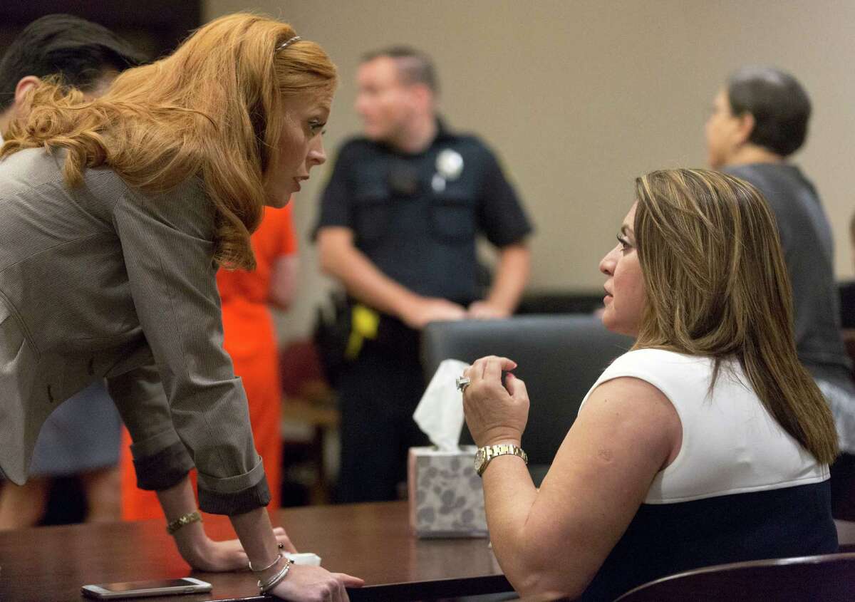 Frances Hall, right, talks to one of her attorneys, Leigh Cutter, in the 186th state District Court in the Candela-Reeves Justice Center Thursday, Sept. 8, 2016 after the jury in her murder trial began their deliberations. Frances Hall is accused of killing her husband, trucking tycoon Bill Hall, by knocking his motorcycle off the road with her Cadillac Escalade in 2013.