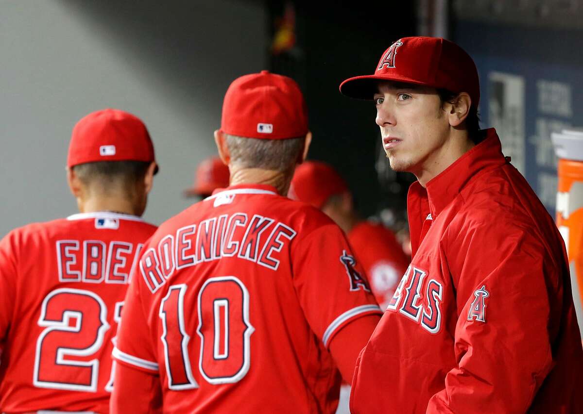 Los Angeles Angels starting pitcher Tim Lincecum stands in the dugout after being pulled from a baseball game against the Seattle Mariners, Friday, Aug. 5, 2016, in Seattle. (AP Photo/Ted S. Warren)