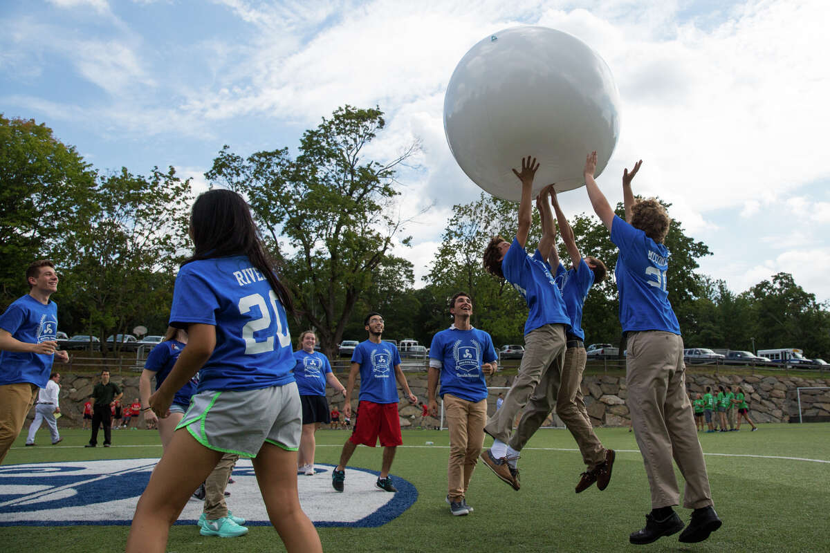 Members of the Twain House leap to keep the ball up in the Triskelion Cup during the Stanwich School's annual Welcome Back Picnic and Triskelion Cup Kickoff at the Stanwich School in Greenwich, Conn. on Friday, September 9, 2016.