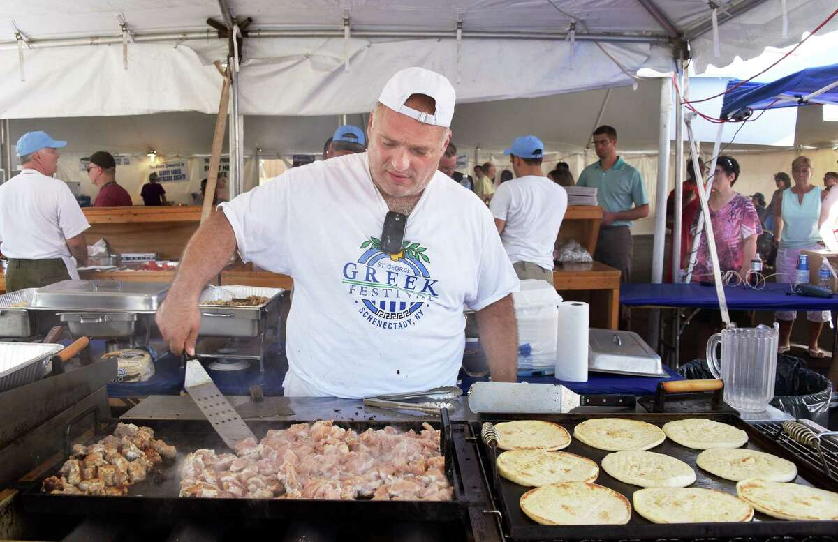 Mike Giakoumis of Scotia cooks chicken souvlaki at the 41st annual St. George Greek Festival in 2016 in Schenectady.