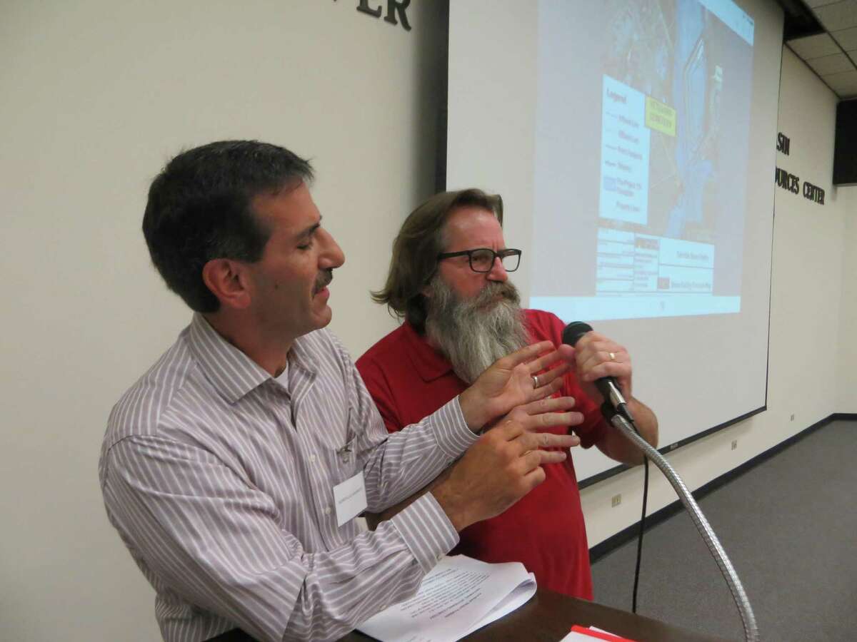 Kerrville City Councilman Gary Stork (right) tried to wrest the microphone from George Baroody, a member of The Kerrville Majority, a group formed to challenge the direction of the city under the current city council, at a town hall meeting Sept. 8, 2016. Stork’s death two weeks later was ruled a suicide this week.