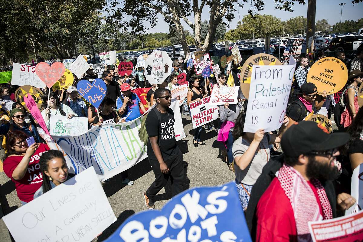 Demonstrators march on Bernal Avenue against Urban Shield 2016 outside Alameda County Fairgrounds in Pleasanton, Calif. on Friday, Sept. 9, 2016.
