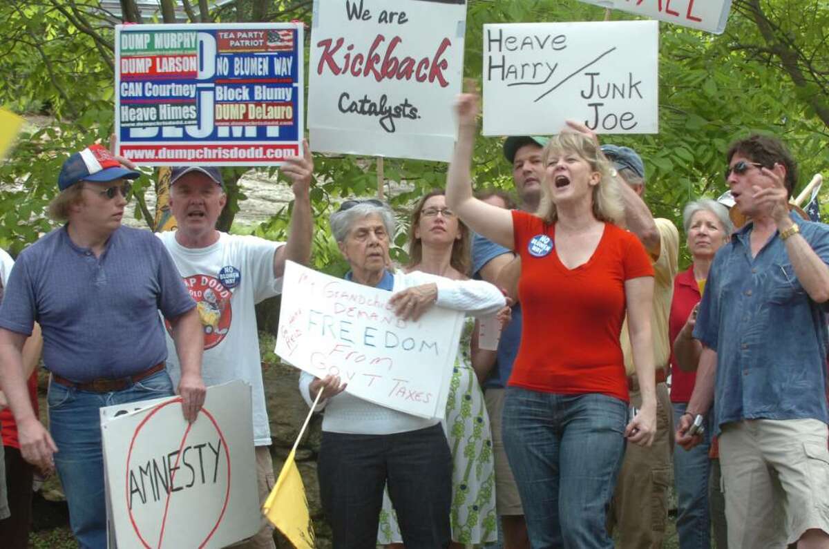Mary Babinski, second from the right, from North Branford, and others lined up on Meadow Lane in Greenwich, to protest Sen. Joseph Lieberman's fundraiser for Sen. Harry Reid, D-Nev., on Sunday, May 2, 2010.