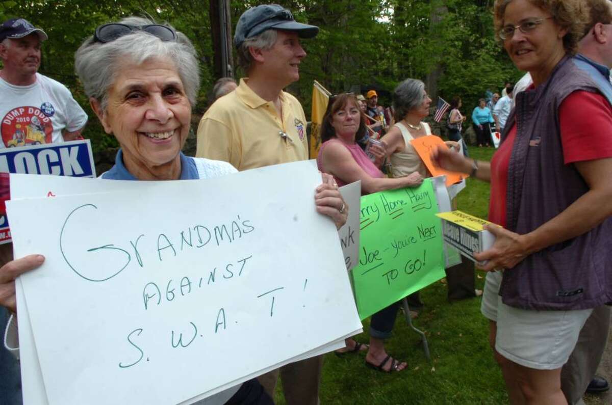 Protesters demonstrate against Reid and Lieberman