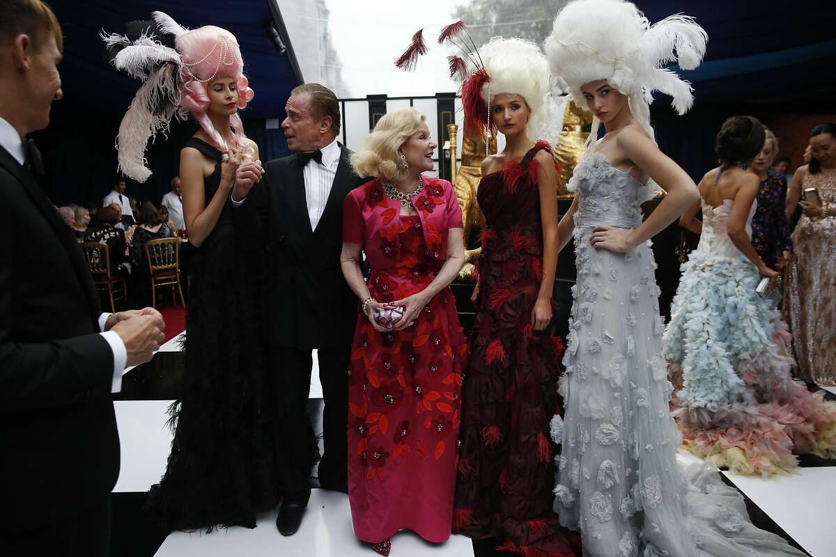 Boaz Mazor and Dede Wilsey pose with models during the Opera Ball, celebrating the opening night of the San Francisco Opera Sept. 9, 2016 in San Francisco, Calif.