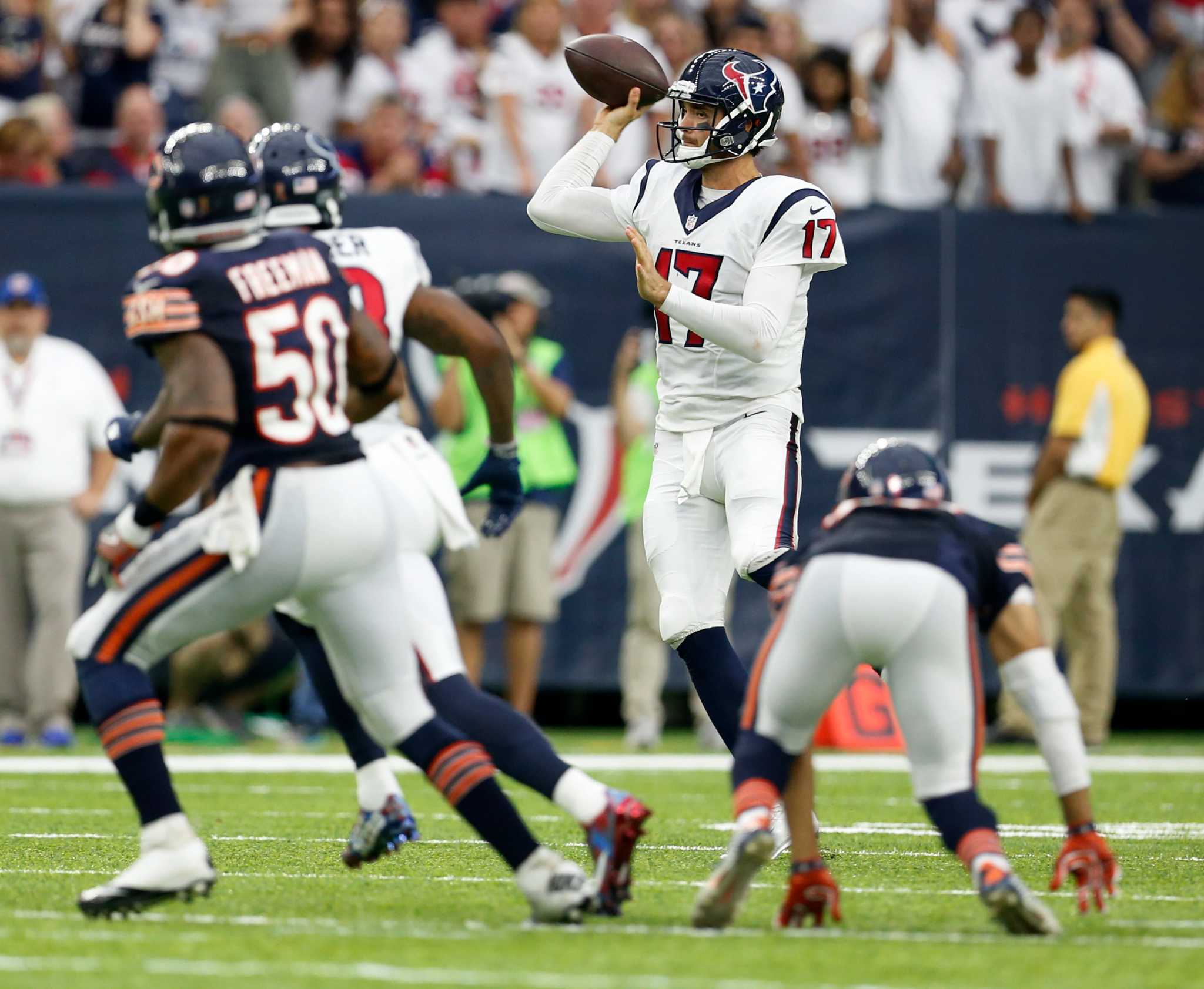 Washington Redskins quarterback Robert Griffin III (10) talks to Houston  Texans inside linebacker Brian Cushing (56) and defensive end J.J. Watt  (99) during the fourth quarter of an NFL football game Sunday