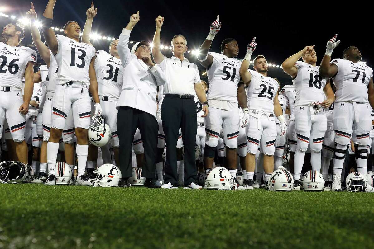 CINCINNATI, OH - SEPTEMBER 1: Head Coach Tommy Tuberville of the Cincinnati Bearcats celebrates with his team after defeating the Tennessee-Martin Skyhawks 28-7 at Nippert Stadium on September 1, 2016 in Cincinnati, Ohio.