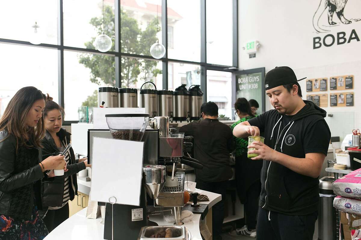 Co-owner, Andrew Chau, mixes matcha for the strawberry matcha tea at Boba Guys in S.F.