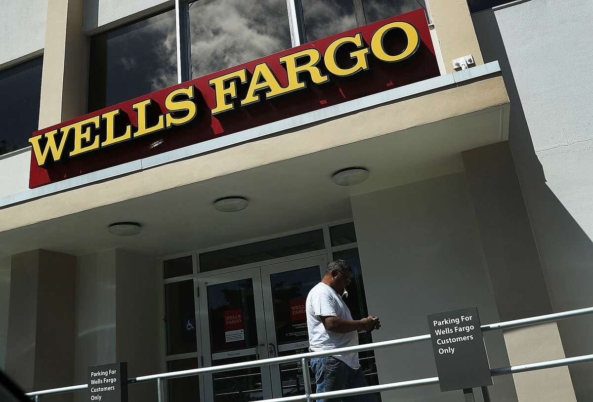MIAMI, FL - SEPTEMBER 09: A Wells Fargo sign is seen on the exterior of one of their bank branches on September 9, 2016 in Miami, Florida. Reports indicate that more than 5,000 Wells Fargo employees have been fired as a result of a scandal involving employees that secretly set up new fake bank and credit card accounts in order to meet sales targets. (Photo by Joe Raedle/Getty Images)