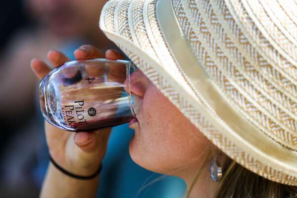 Linnea Hardlund takes a sip of wine during a wine tasting at Pilot's Peak winery in Penn Valley, California, on Saturday, Sept. 3, 2016.