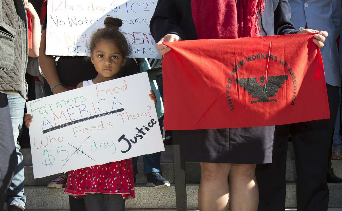 Camila Cortez, 4, the granddaughter of a farmworker, joins others at a rally calling for passage of a bill that would require farmworkers to receive overtime after working eight hours, starting in 2019, Thursday, Aug. 25, 2016, in Sacramento, Calif. The bill AB1066 by Assemblywoman Lorena Gonzalez, D-San Diego, is expected to be brought to a vote, Thursday.(AP Photo/Rich Pedroncelli)