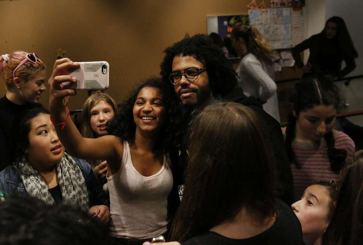 Uma Nagarajan-Swenson, 15, takes a selfie with Hamilton star Daveed Diggs after a question and answer session with him and Poetry Slam alum Chinaka Hodge in the teen center at the Jewish Community Center of San Francisco Sept. 10, 2016 in San Francisco, Calif.