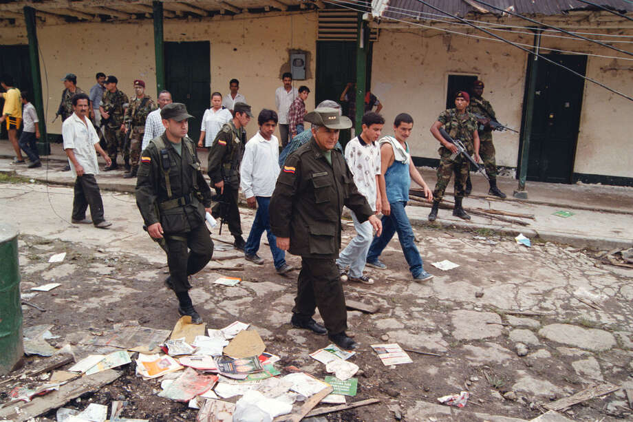 Terrifying footage shows dozens of uniformed gunmen of the Jalisco drug cartel i