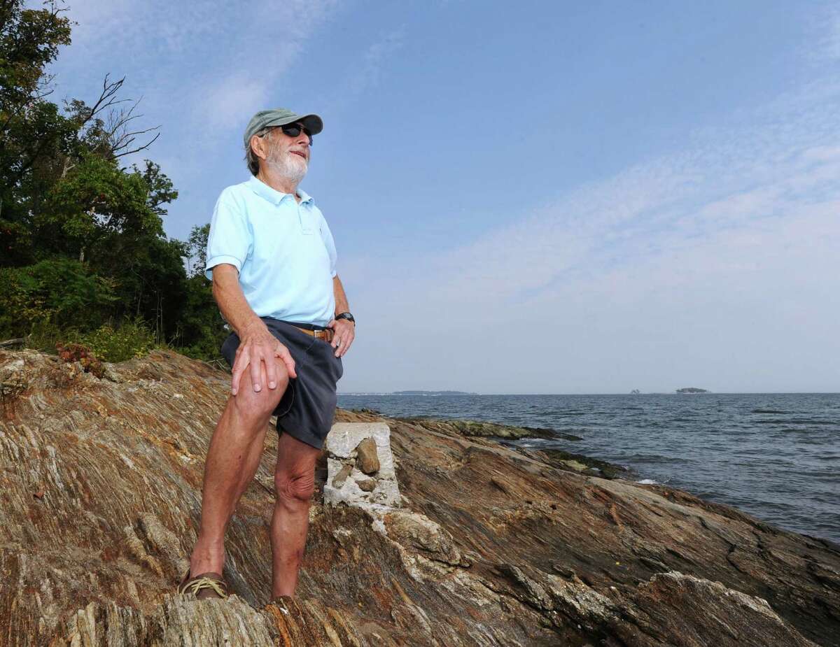 Franklin Bloomer of the Calf Island Conservancy stands on a rock outcropping during the Calf Island Conservancy and Greenwich Audubon tour of Calf Island off the coast of Greenwich. A group of about 25 people were given a guided wildlife tour of Calf Island by Audubon naturalists.