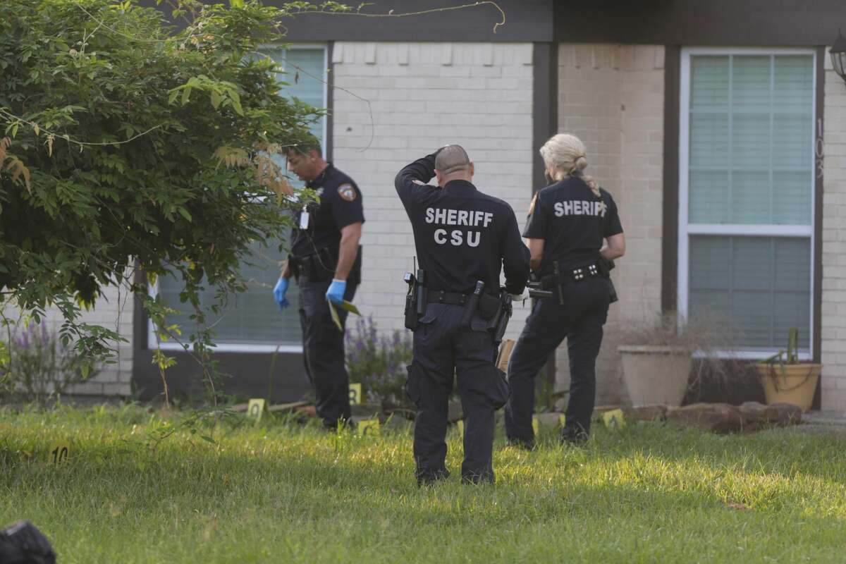 Harris County sheriff's deputies comb over a home in the 100 block of Spanish Trace Street in Crosby, Texas, on Sept. 13, 2016. Earlier that morning, a resident shot and wounded a man during an attempted home invasion.
