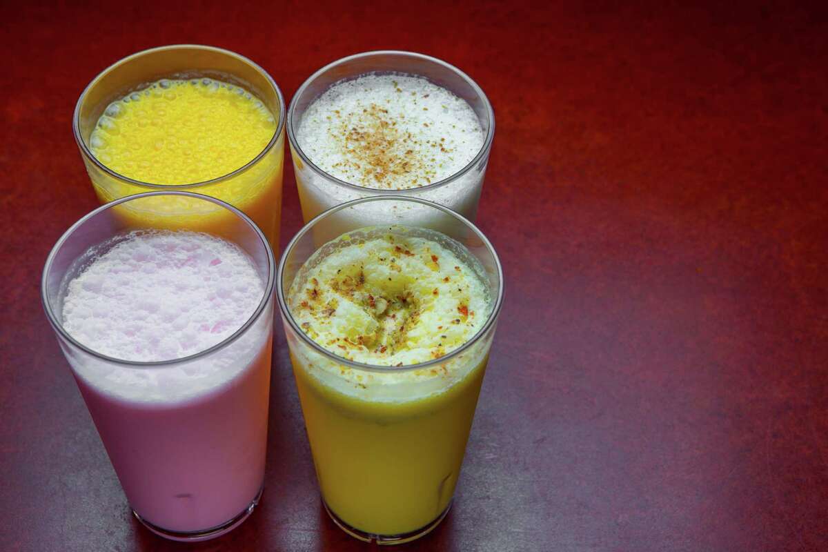 From top left: mango shake, salt lassi, rose milk and badam milk at Shri Balaji Bhavan