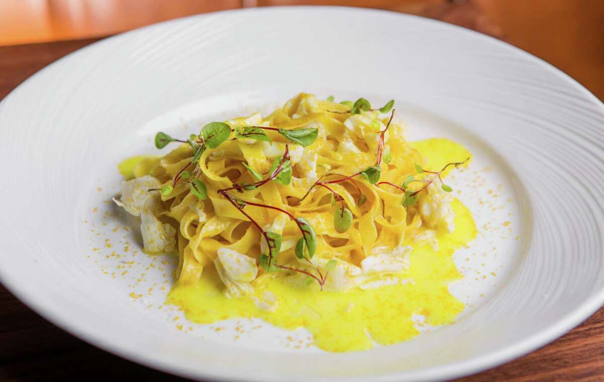 SaltAir's saffron fettuccine handmade pasta with crabmeat, lemon butter, and bottarga.