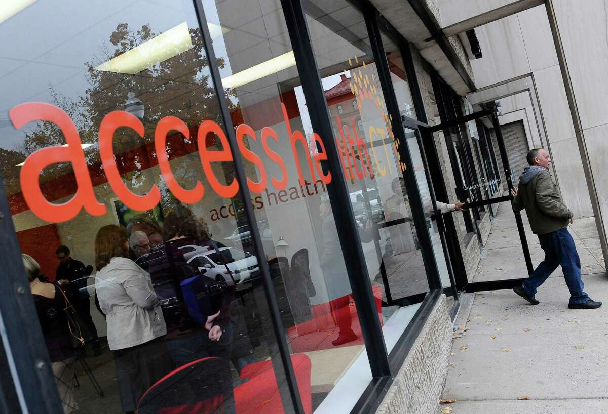 A man leaves Access Health CT, Connecticut's health insurance exchange insurance store, in New Britain. Local insurance company ConnectiCare just announced that it could pull out of the exchange, leaving it without its largest insurer.
