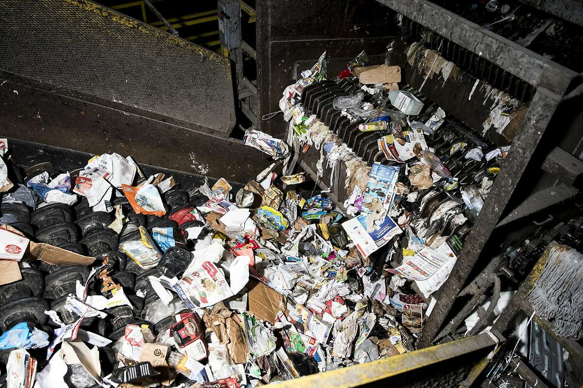 Recyclable materials are seen traveling through a sorting machine at Recology's Recycle Central at Pier 96 in San Francisco, Calif. on Monday, Sept. 12, 2016.