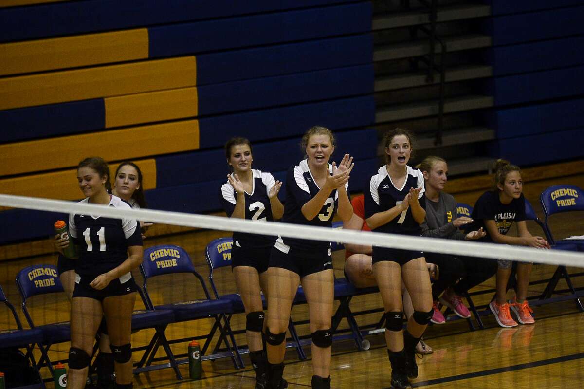 Mount Pleasant celebrates a point during their game against Midland on Tuesday at Midland High School.