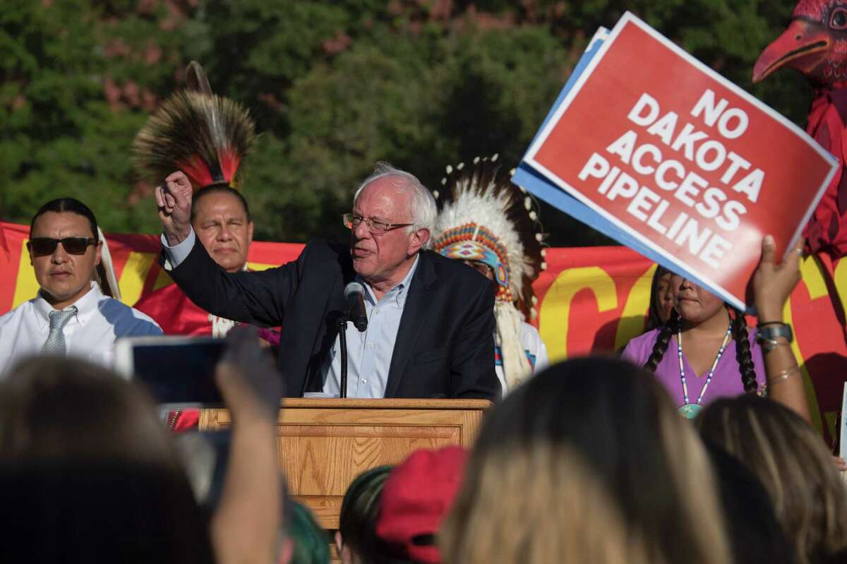 US Senator Bernie Sanders (C) speaks during a rally in front of the White House in Washington, DC, September 13, 2016, as demonstrators gathered to protest the Dakota Access Pipeline. The US government on September 9, 2016 sought to stop work on a controversial oil pipeline in North Dakota that has angered Native Americans, blocking any work on federal land and asking the company to "voluntarily pause" work nearby. / AFP PHOTO / JIM WATSONJIM WATSON/AFP/Getty Images